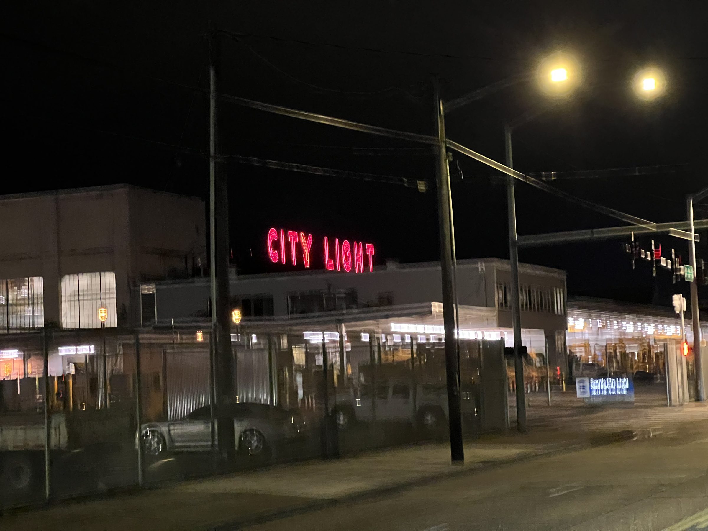 The original CITY LIGHT neon sign in Seattle's Georgetown neighborhood — direct source for the exhibit's title.