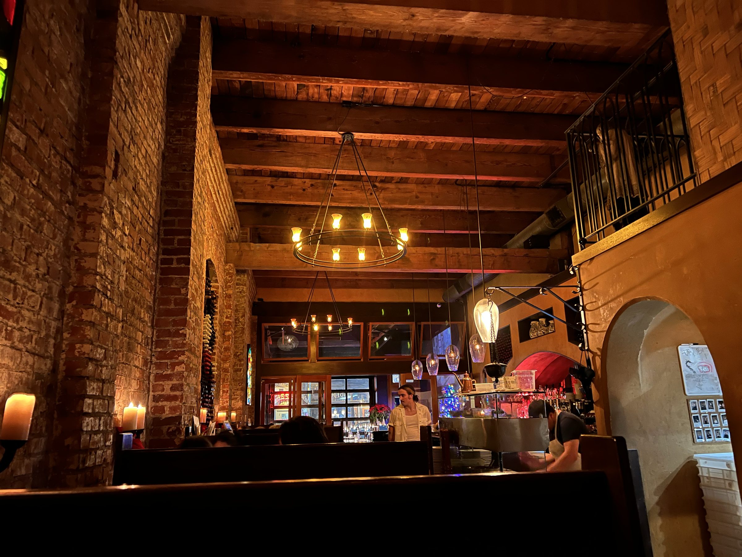 Industrial ceiling and overhead infrastructure of the raw studio shell.