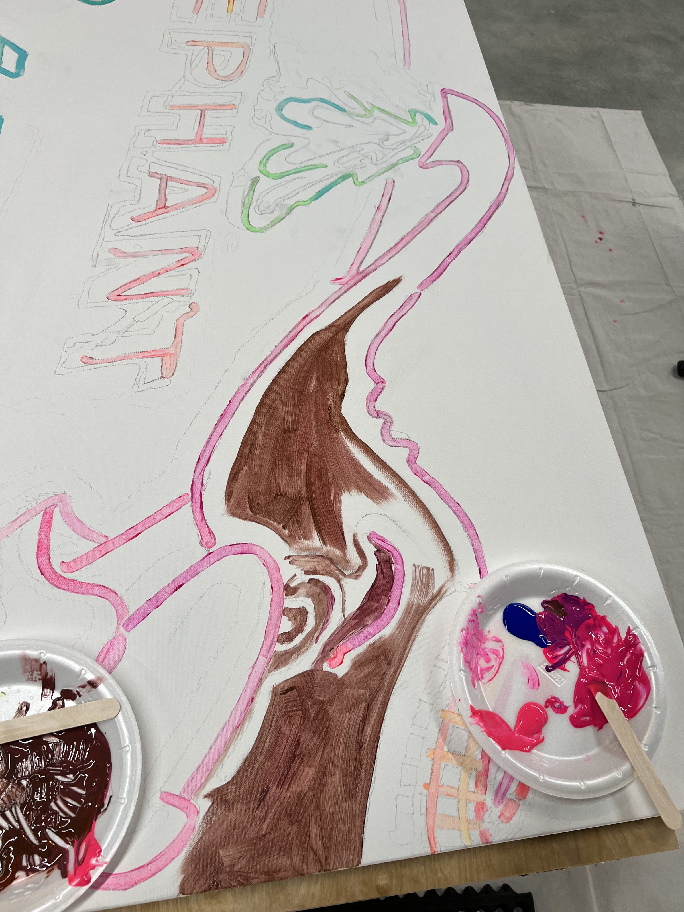 Top-down view of the Pink Elephant marquee panel in early underdrawing — pink outline of the elephant.