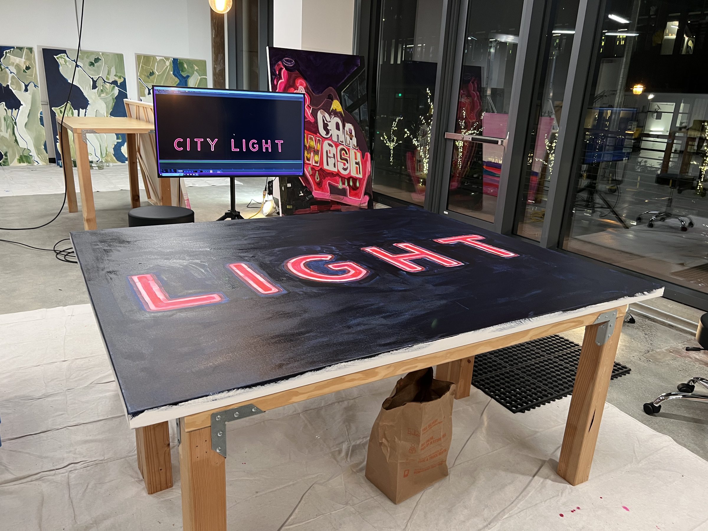 The CITY LIGHT diptych at near-final state, palette in hand.