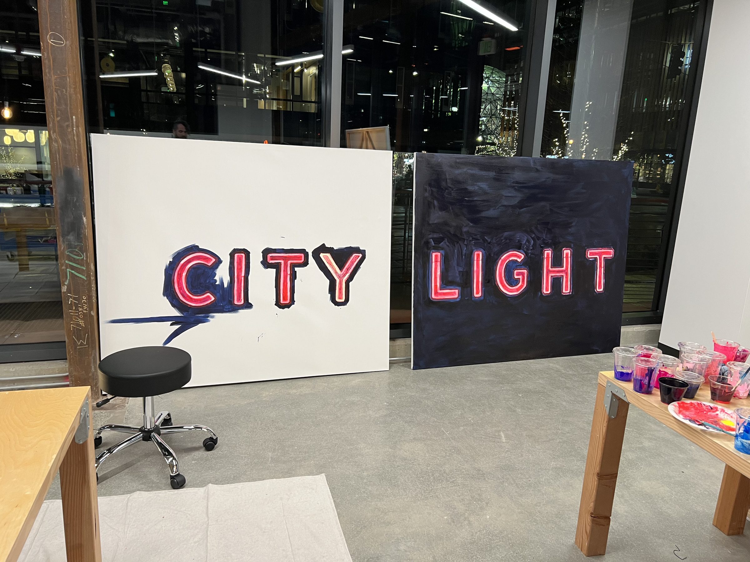 The finished CITY LIGHT title piece against the studio wall.