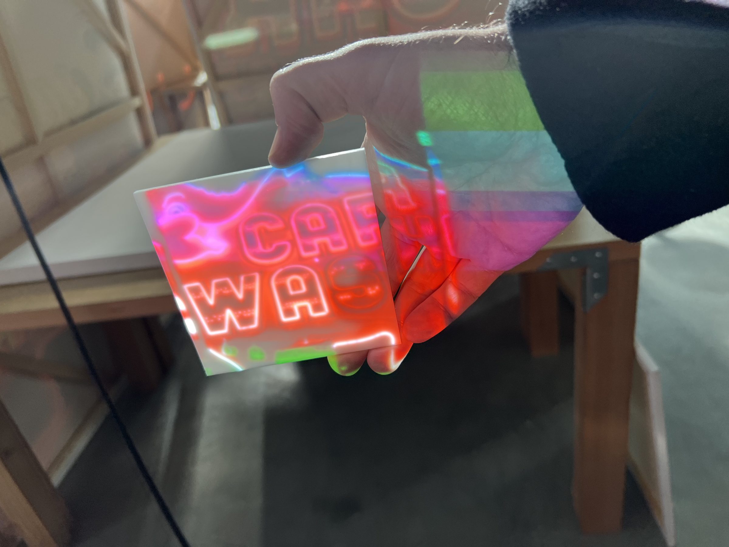 Holographic CAR WASH decal in iridescent light.